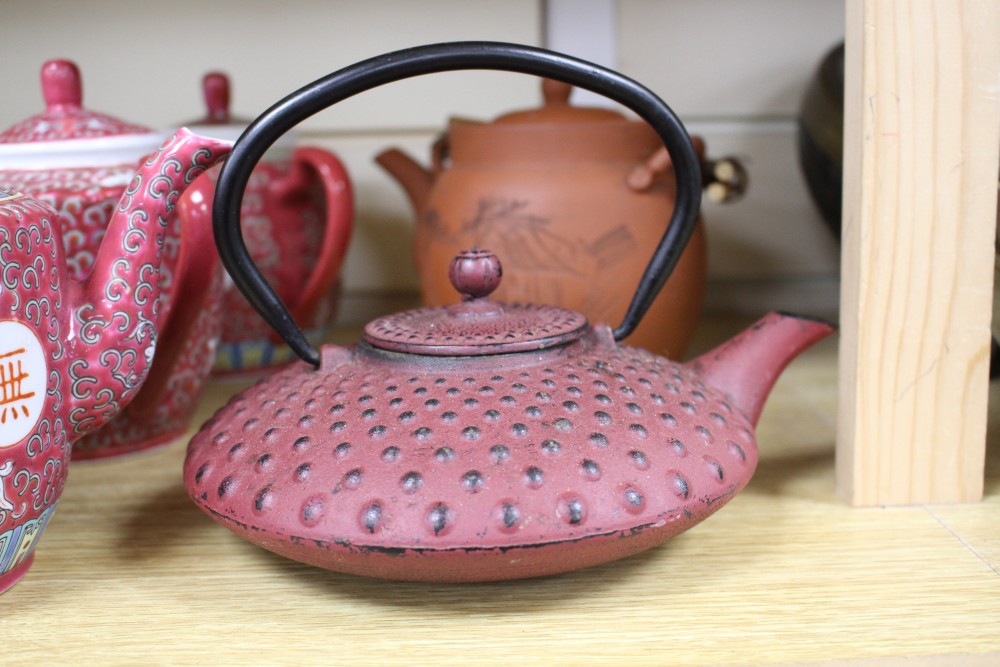 Three Chinese blue and white prunus pattern ginger jars, two other jars and ten assorted teapots